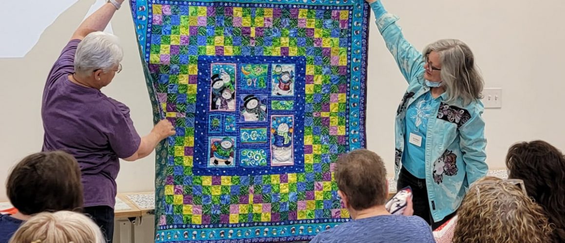 quilters showing quilts